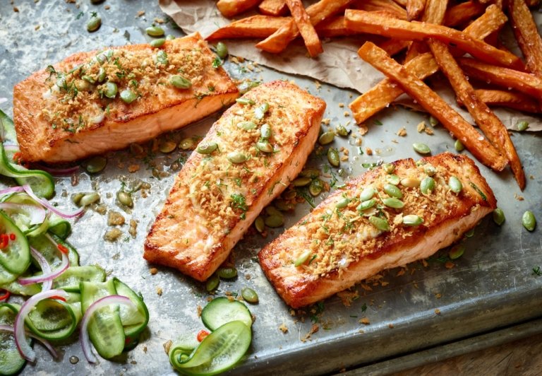 Overhead shot of three baked salmon fillets