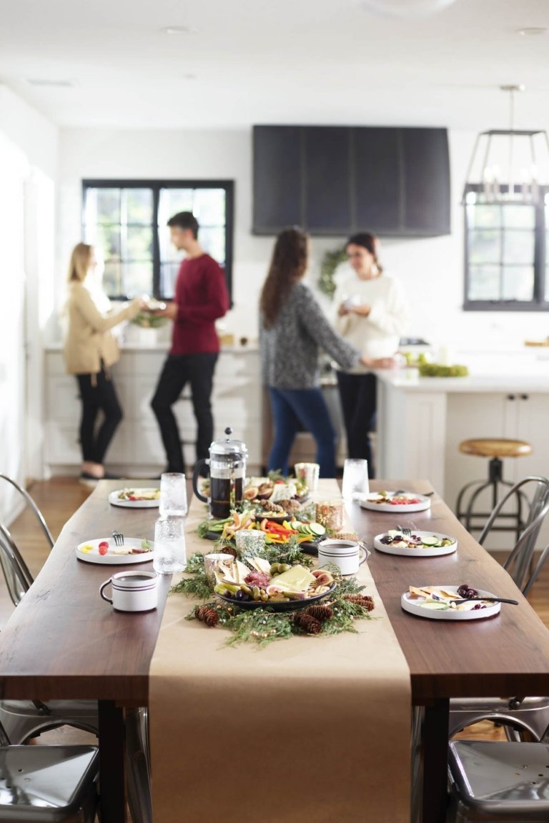 Lifestyle of a table with breakfast food and people in the background