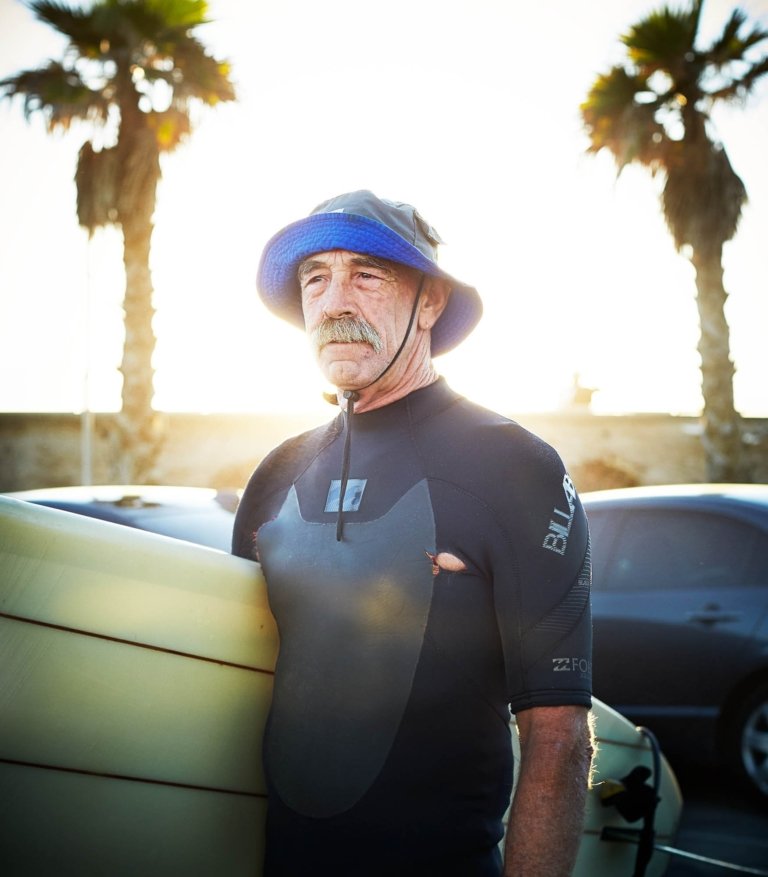 An old surfer with a mustache in California