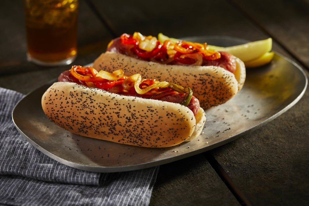 Poppy seed hot dog with peppers and onions