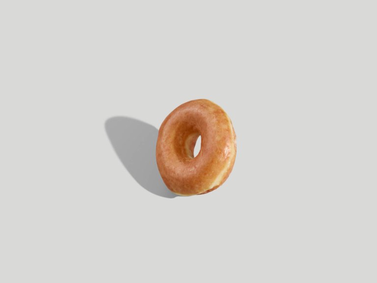 A perfectly glazed donut - modern - with bold shadow