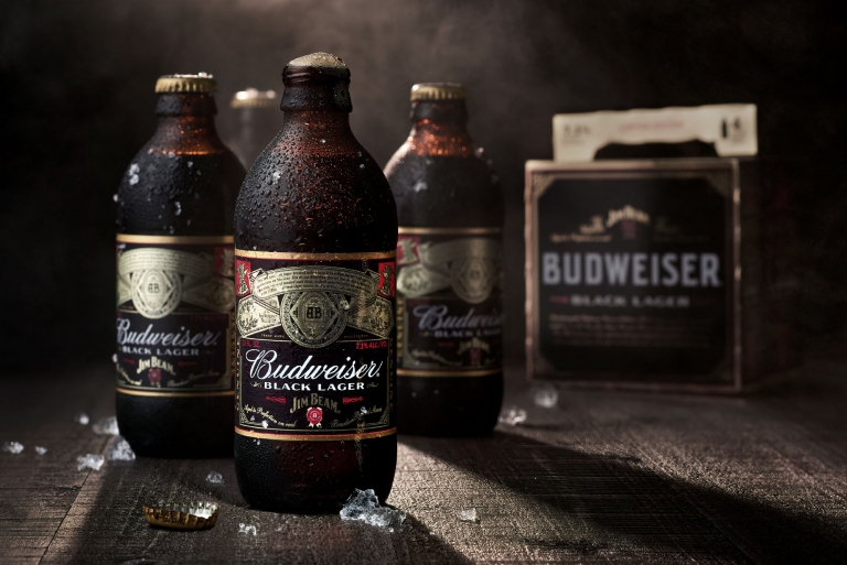 Budweiser beer bottles photographed in dramatic lighting for commercial beverage advertising