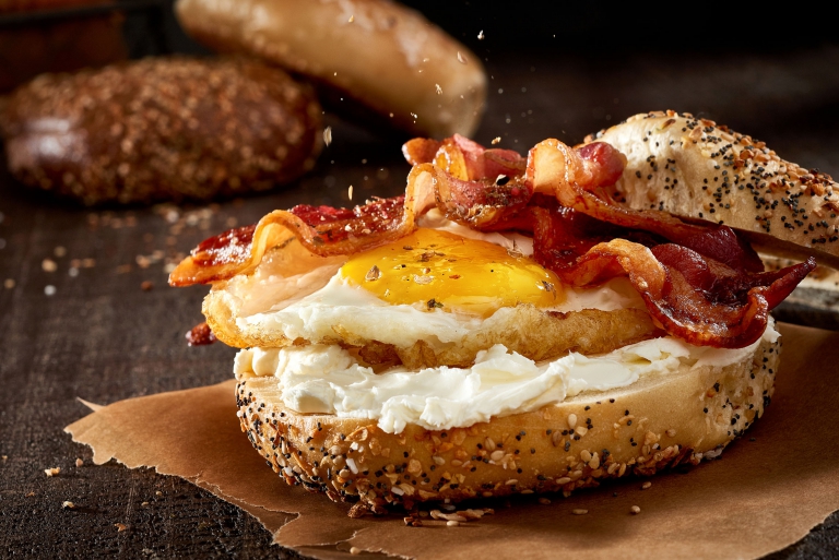 Bagel breakfast sandwich with bacon, egg, and cream cheese — commercial food photography by OMS Photo