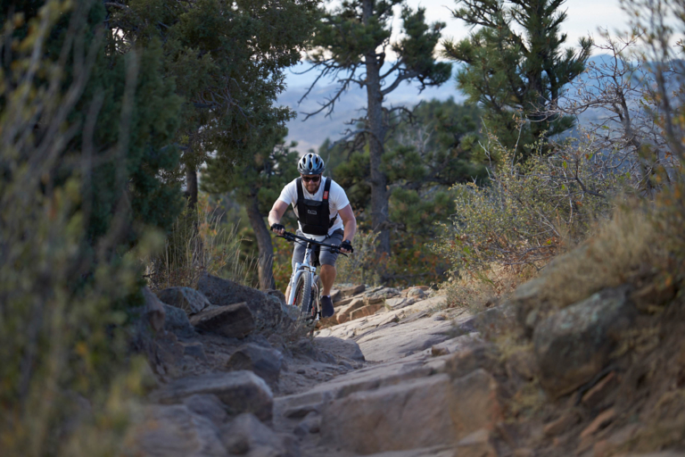 A man climbing up a rocky terrain - Denver lifestyle photography