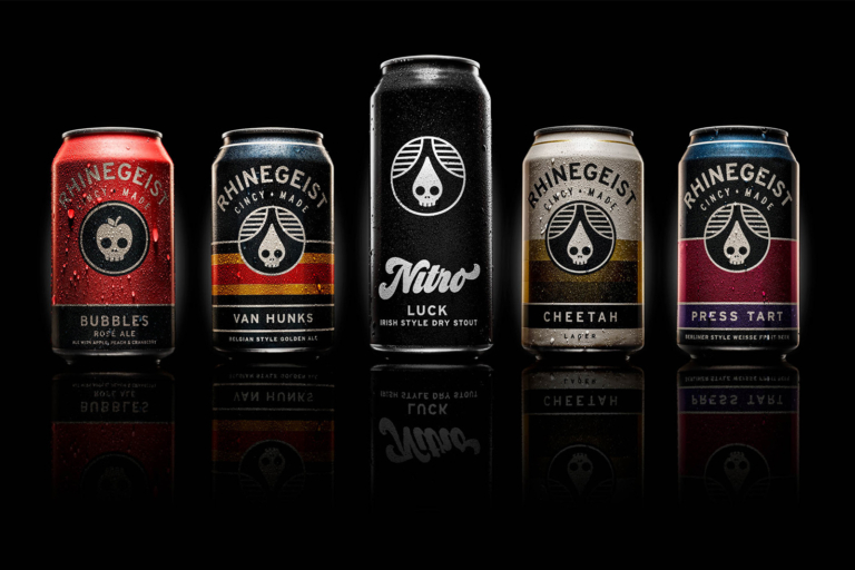 Craft beer bottles and cans photographed on black background for commercial advertising