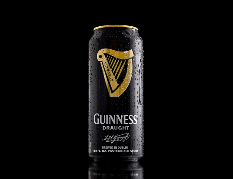 Guinness draught can photographed on black background for commercial brewery advertising