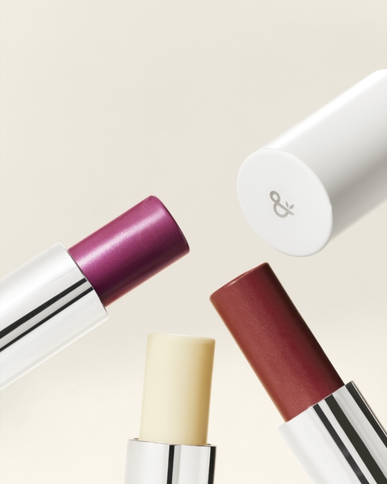 a group of lipsticks in different colors