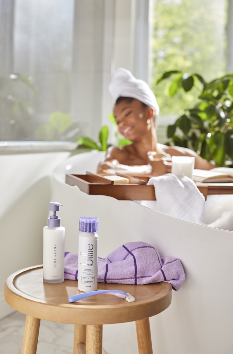 a woman in a bathtub with a towel on her head