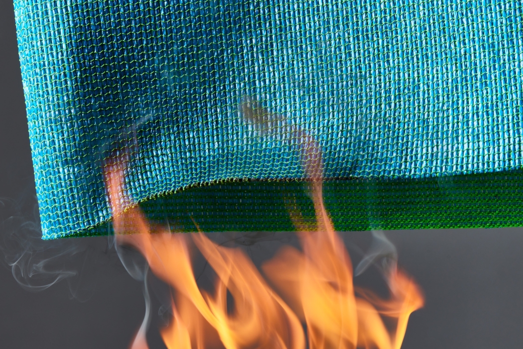 a blue and green mesh with a fire