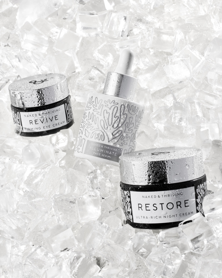 Restore skincare jars and serum styled in crushed ice for luxury commercial campaign
