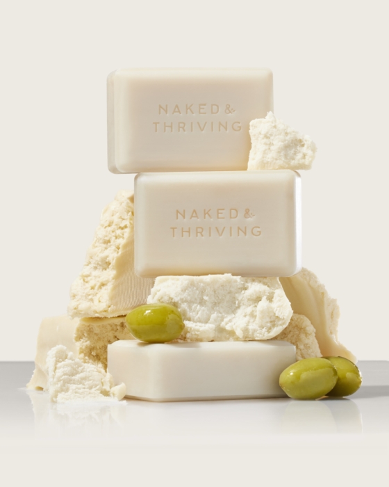 a stack of white soaps with olives