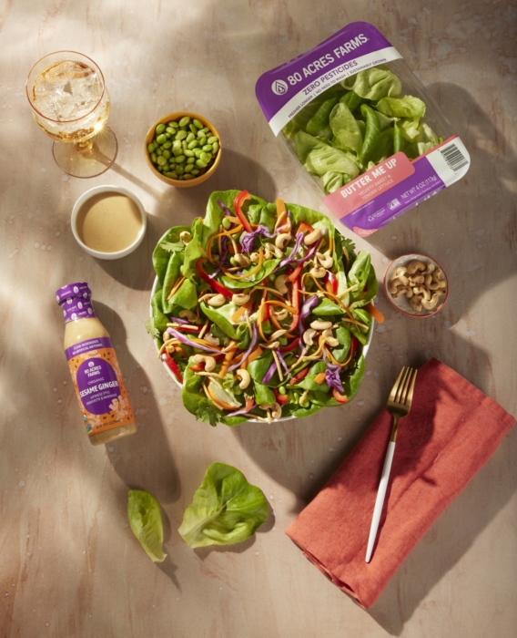 a salad and a bottle of dressing