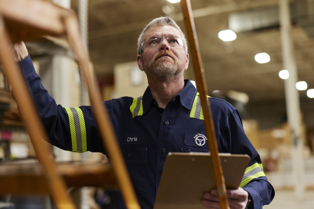 a man holding a clipboard, Cintas, construction, workplace, jobsite, on location