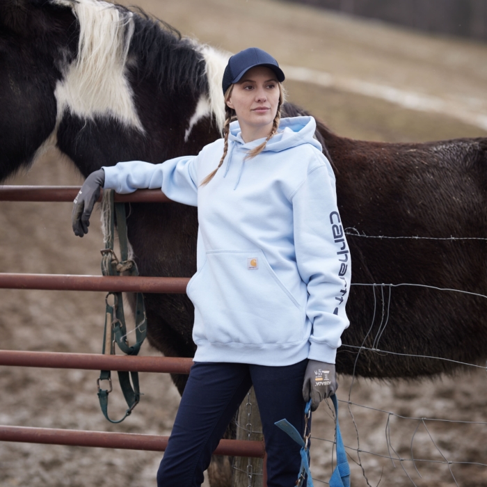 a woman standing next to a horse, Cintas, construction, workplace, jobsite, on location