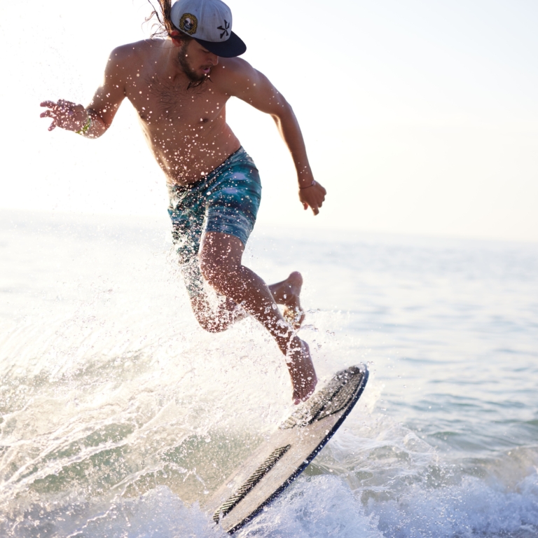 a man on a surfboard in the water