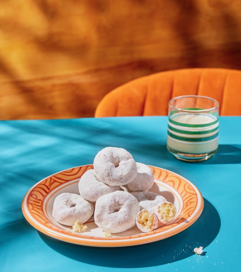 a plate of donuts and a glass of milk