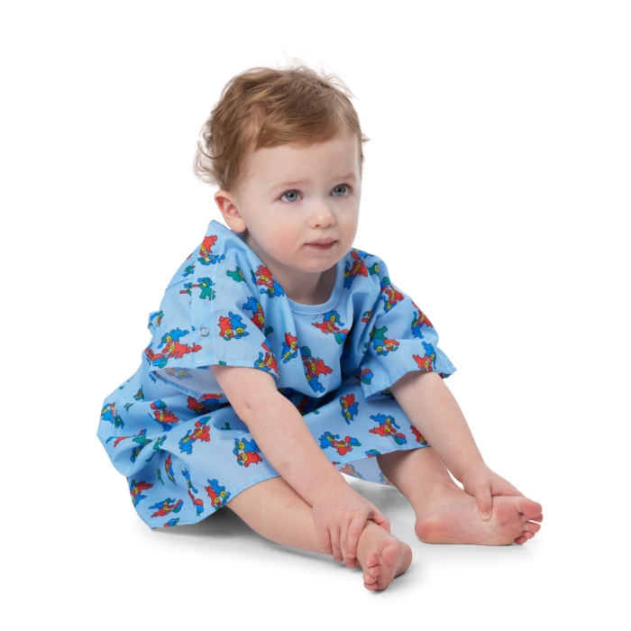 Children wearing colorful pediatric hospital gowns photographed on a white background by Marci Rhodes of OMS Photography – clean textile image showcasing fit, pattern, and comfort.