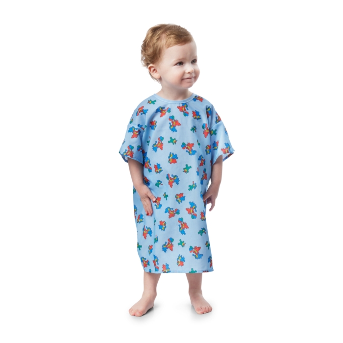 Children wearing colorful pediatric hospital gowns photographed on a white background by Marci Rhodes of OMS Photography – clean textile image showcasing fit, pattern, and comfort.