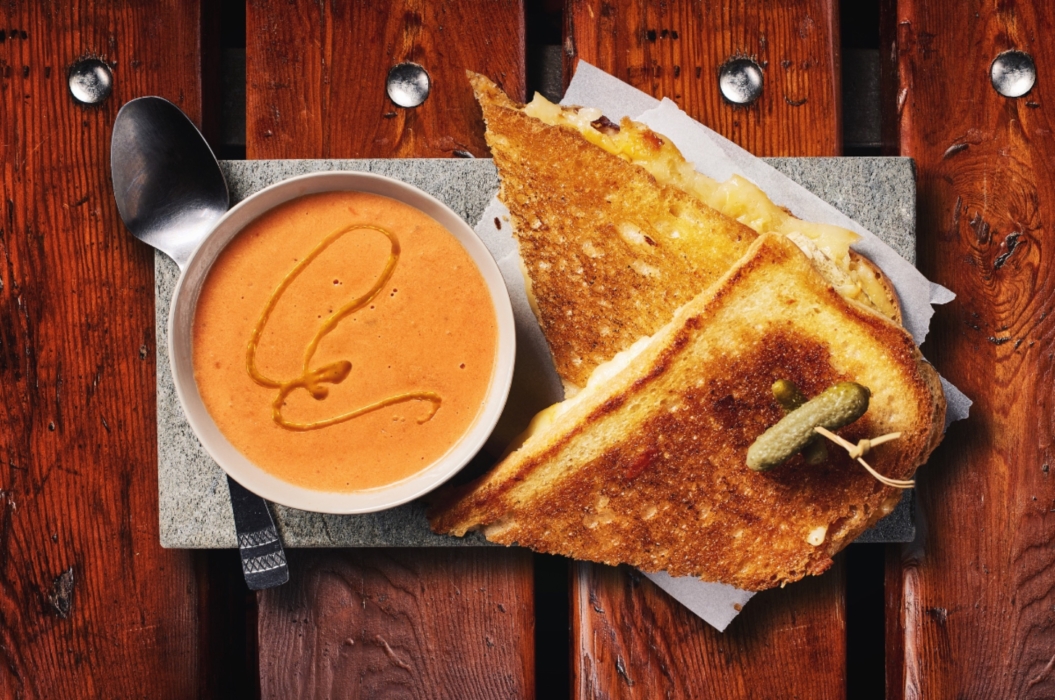 Overhead shot of grilled cheese sandwich with tomato soup and spoon, crisp and detailed food photography by OMS Photography
