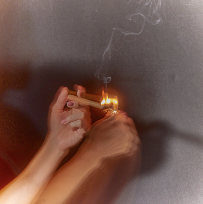 a person lighting a match