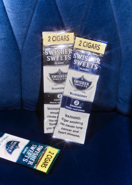 a pack of cigarettes on a blue couch