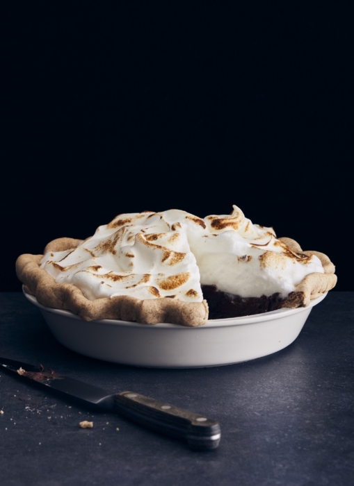 Chocolate pie on a plate against a dark background, styled and photographed for food advertising by OMS Photography