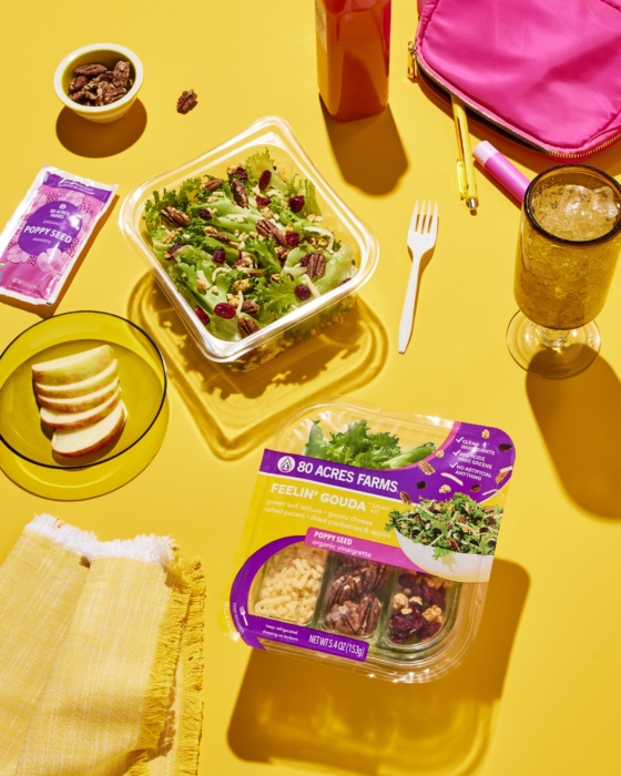 Lifestyle, salad kit, 80 acres, food, person, table, nuts, apple, bread, salad, dressing, yellow