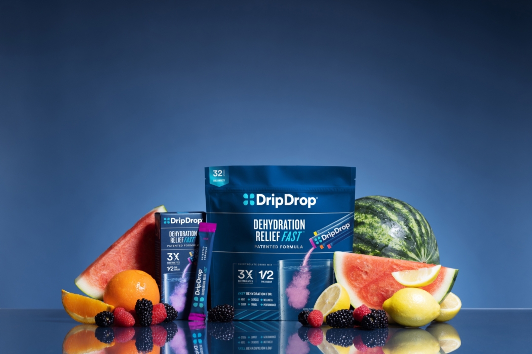 Hydration drink powder packaging photographed with fresh fruit for commercial beverage campaign