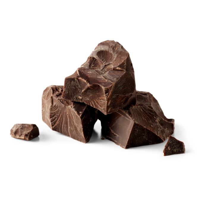 Chunks of dark chocolate stacked on a clean white background.