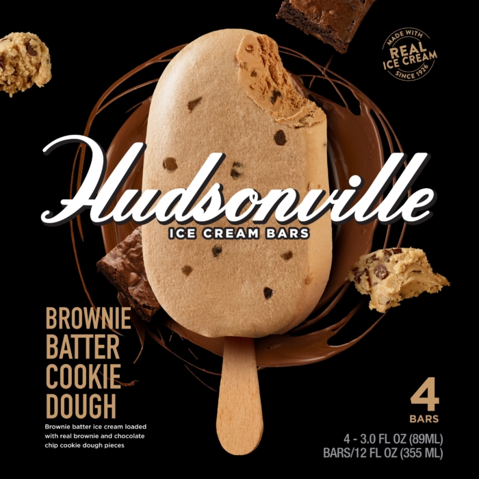 Commercial food photography of brownie batter cookie dough ice cream bar with chocolate chip pieces and brownie chunks on black background for CPG packaging