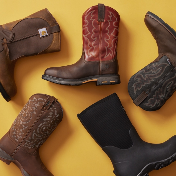 Assortment of western cowboy boots arranged on a yellow background