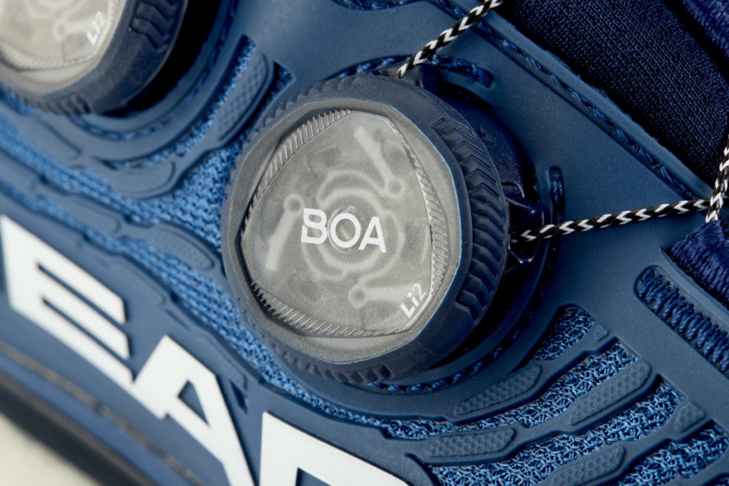 Extreme close-up macro shot of BOA fit system dial on athletic shoe, commercial footwear detail product photography by OMS Photo