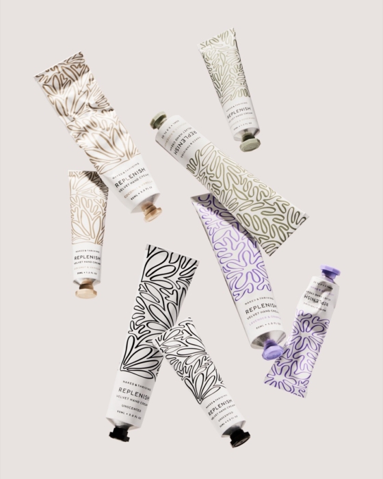 Naked & Thriving hand cream tube collection in various prints flat lay on cream background