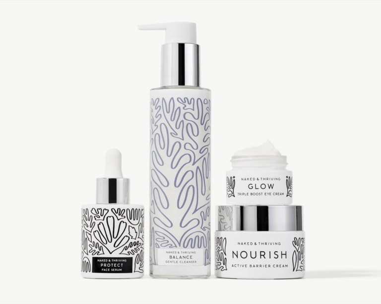 Four Naked & Thriving skincare products on a clean white background: Protect Face Serum black dropper bottle, Balance Gentle Cleanser tall pump bottle, and stacked Glow Triple Boost Eye Cream open jar on top of Nourish Active Barrier Cream jar, with white packaging and botanical line art