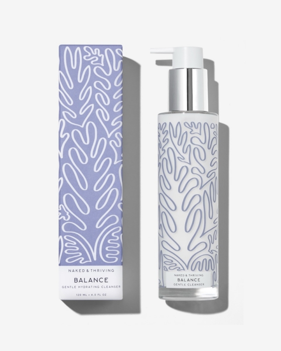 Naked & Thriving Balance Gentle Hydrating Cleanser pump bottle with chrome silver pump beside its periwinkle blue retail box on a white surface, angled composition with soft natural shadows, showing 120ml size and botanical line art label