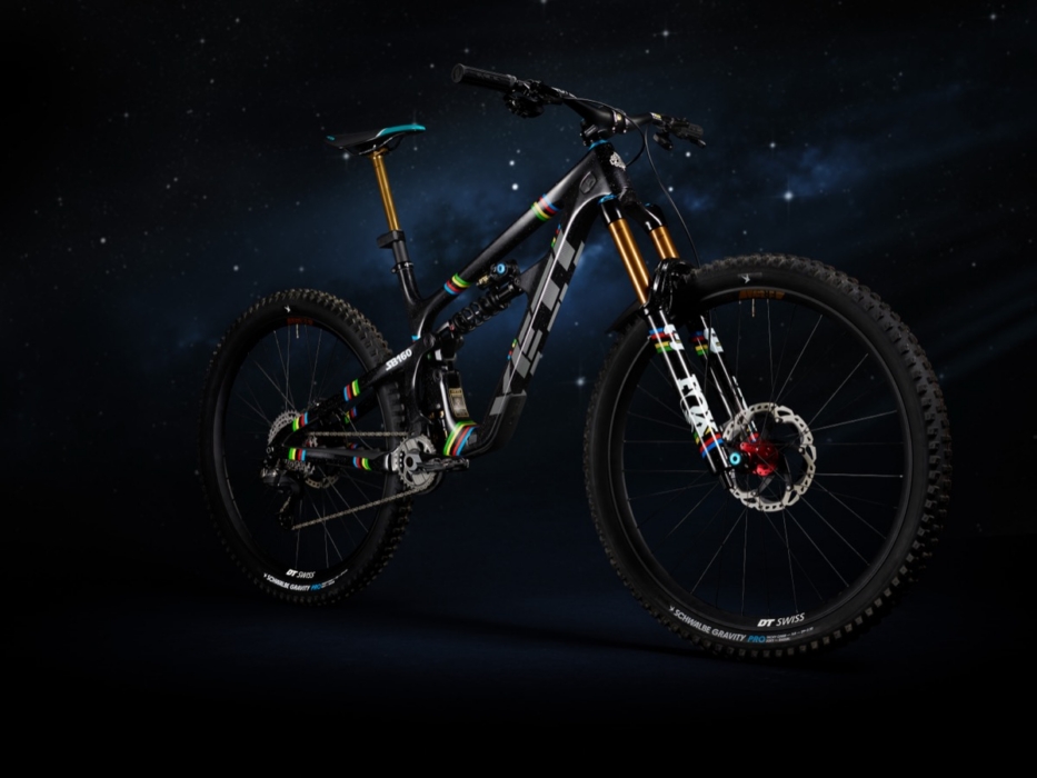 Full drive-side studio portrait of Yeti SB160 Richie Rude 2025 EDR World Champion Special Projects mountain bike against starfield background, showing Shimano XTR drivetrain, Fox 40 fork, DT Swiss Schwalbe Gravity Pro wheelset, and complete UCI rainbow stripe livery