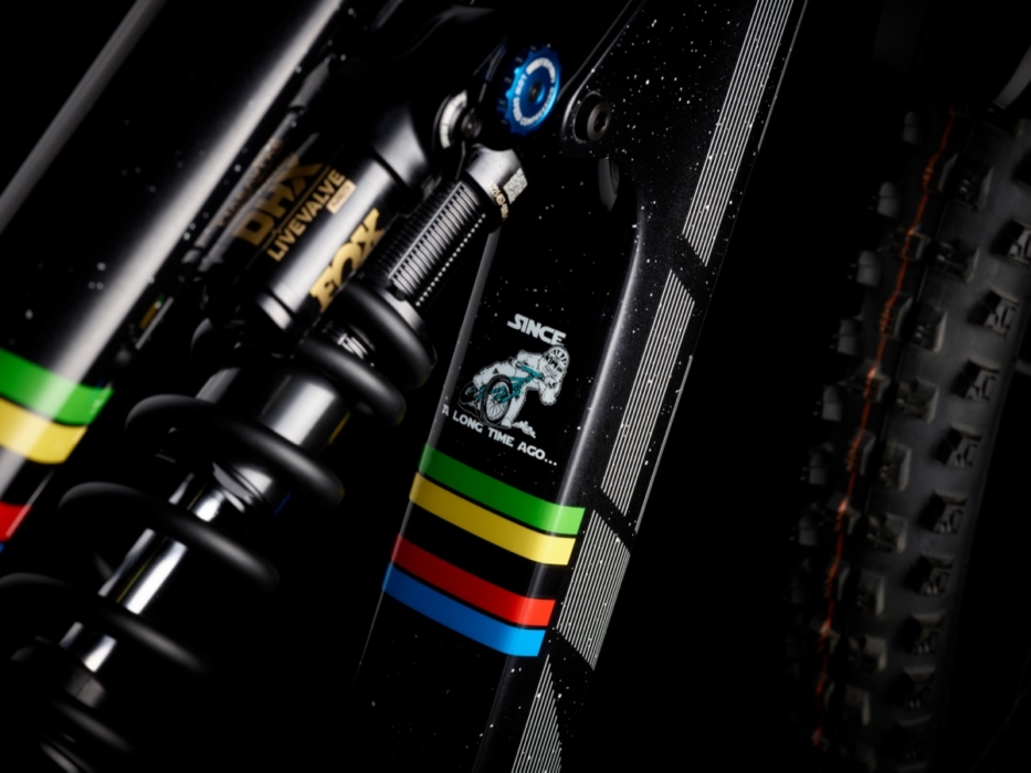 Close-up of FOX DHX LiveValve rear shock on Yeti SB160 Richie Rude 2025 EDR World Champion Special Projects mountain bike, featuring UCI rainbow stripes and custom "Since a Long Time Ago" astronaut graphic on black carbon frame
