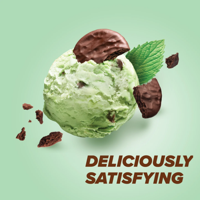 Pure Protein Mint Chocolate Chip protein bar with mint ice cream scoop and chocolate chips on green background