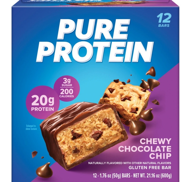Pure Protein Chewy Chocolate Chip protein bar box with chocolate chip bar pieces on purple background