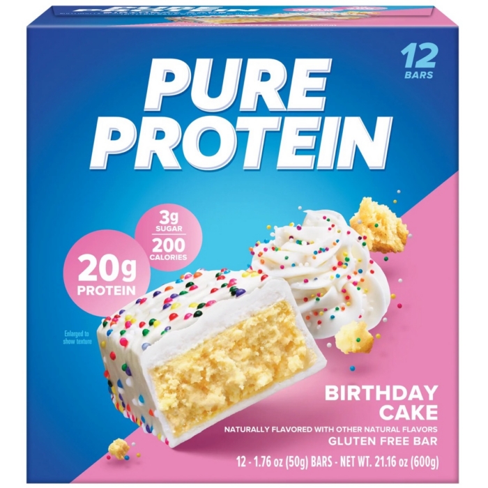 Pure Protein Birthday Cake flavor protein bar box with colorful sprinkles on pink background