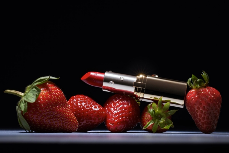 Red lipstick and strawberries